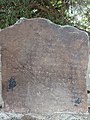 A Meitei language stone inscription in Meitei script about a royal decree of a Meitei king found in the sacred site of God Panam Ningthou in Andro, Imphal East, Manipur.