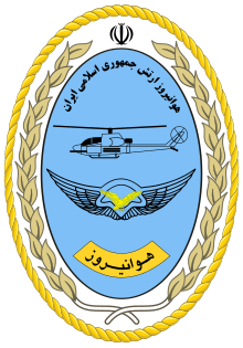 A blue egg-shaped seal with a golden border and with the Persian name of the unit at its top and its Persian acronym Havanirooz at bottom with a diagram of an AH-1J SeaCobra in the middle