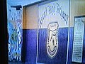 The school crest on a mural.