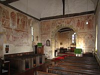 The 12th-century frescos in St Botolph's Church, England, are part of the 'Lewes Group' of Romanesque paintings created for Lewes Priory.[40]