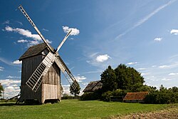 A historic windmill and a cottage in Drewnowo-Lipskie