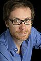 Image 5 Stephen Merchant Photo: Carolyn Djanogly Stephen Merchant (b. 1974) is an English writer, director, radio presenter, comedian, and actor. He is best known for his collaborations with Ricky Gervais, with whom he co-wrote and co-directed the popular British sitcom The Office, co-hosts The Ricky Gervais Show, and co-wrote, co-directed, and co-starred in Extras. More selected portraits