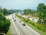 A dual highway with greenery on either side