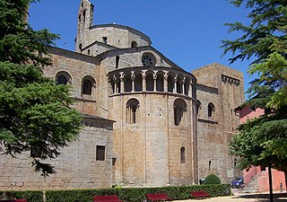 The Cathedral of Santa Maria d'Urgell, Spain, has an apsidal east end projecting at a lower level to the choir and decorated with an arcade below the roofline. This form is usual in Italy and Germany.