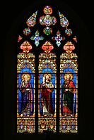 A brightly coloured window at Cassagnes-Bégonhès, Aveyron