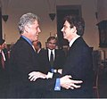 Bill Clinton and Tony Blair embracing each other at a conference in Florence, Italy, 1999.