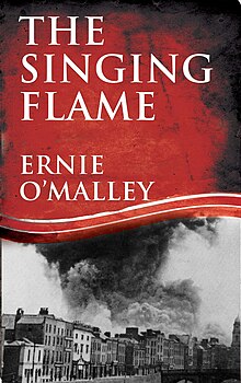 "Colour photograph of the front cover of The Singing Flame by Ernie O'Malley, showing a large plume of smoke above buildings on a waterfront"