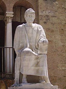 Statue of a sitting man in Arabic garb