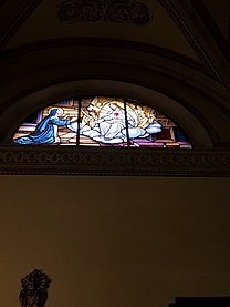 Grass window in the church representing the love of Jesus in the right side of the Church of St. Peter and Paul, Arese