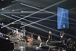 Red Hot Chili Peppers live in 2013. Left to right: Chad Smith, Mauro Refosco, Flea, Anthony Kiedis, and Josh Klinghoffer