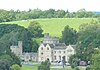 A country house with a large battlemented tower