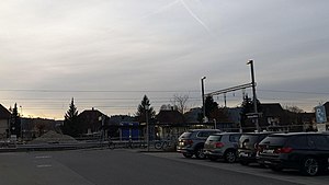 Parking lot in front of platform with shelter