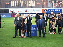 Kurzawa with Pogoń Szczecin receiving a bronze medal.