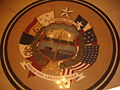 A display of the six flags of Texas as a floor in the Capitol Annex