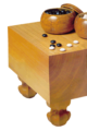 Image 15A traditional Japanese set, with a solid wooden floor board (碁盤 goban), 2 bowls (碁笥 goke) and 361 stones (碁石 goishi) (from Go (game))