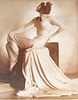 Woman in white dress in profile