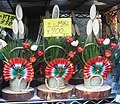 Three miniature kadomatsu being sold outside for 700 Yen each