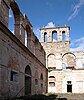 Crumbling stone walls of the Santa Maria de Ovila monastery stand without a roof