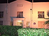 A two-storey white building with a sign that readse "Ealing Studios".