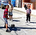 Image 24Plaquita, a Dominican street version of cricket. The Dominican Republic was first introduced to cricket through mid-18th century British contact, but switched to baseball after the 1916 American occupation. (from Culture of Latin America)