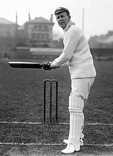 A cricketer preparing to hit the ball.