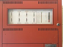 A Fire-Lite Sensiscan 1000 fire alarm control panel in a building at Oklahoma State University.