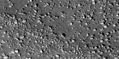 Close view of boulders along crater rim Boulders are roughly the size of cars or small houses. Picture taken with HiRISE under HiWish program.