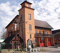 Cross, monument and fire station in village's centre