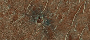 Crater with colorful ejecta, as seen by HiRISE The ejecta represents samples of material from underground. Craters allow us to study underlying material.