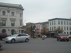 The 1906 Beaux-Arts architecture (left) on the borough's Lincoln Square[1] was the First National Bank building used as a WWII spotter post for aircraft[2] and became the Adams County National Bank after the 1962 merger with the Littlestown State Bank and Trust Company.