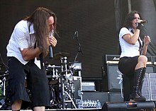 Lacuna Coil's two lead singers, Cristina Scabbia and Andrea Ferro performing live.