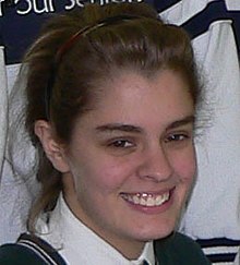 This photograph is of a young woman with a widow's peak.