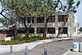 Historic photograph of the Old Scripps Building, a rectangular structure on a clifftop overlooking the Pacific breakers.