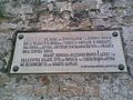 A commemorative sign on the clock tower in Bitola.