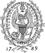 A vertical oval-shaped black and white design with a bald eagle whose wings are spread and who is grasping a globe and a cross with its claws. Around the seal are leaves and the numbers 17 and 89 appear on either side.