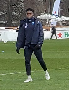 Maheshe on the pitch for warm-up before a match