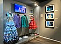 Glass display with dresses and jackets from the Eurovision Song Contest.