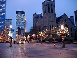 A quiet street in Downtown Minneapolis on a winter night with the IDS Center in the distance