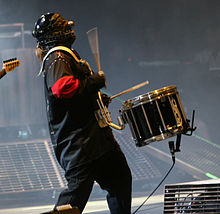 A drummer performs on stage.