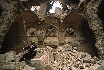 Vedran Smailović playing a cello on top of the ruins of the National library (in 1992)