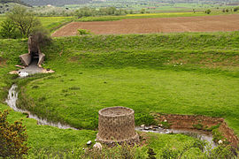 Collecting basin, stone rake, ponor (behind viewer), Peloponnese