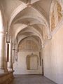 Cloister in the former monastery. Note the restoration of the painted decoration