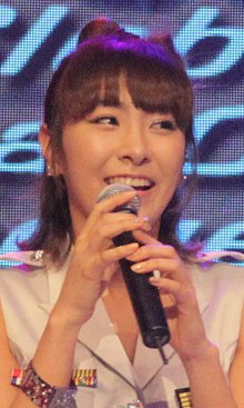 Huh appearing at a press event in 2011 as part of F-ve Dolls.