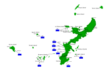 Map of a crescent-shaped island, with plans for four American divisions to land on its western shore