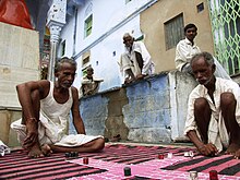 A street-corner game of pachisi in Pushkar, Rajasthan.