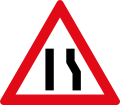 Road narrows to left