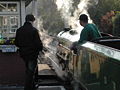 No 1 Green Goddess passes Hythe signal box with an evening departure for New Romney