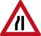 Road narrows from left ahead