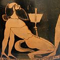 A bald, bearded, horse-tailed satyr balances a winecup on his penis, on an Attic red-figured psykter, c. 500–490 BC