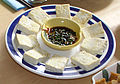 Pan-fried tofu served with seasoned soy sauce for dipping